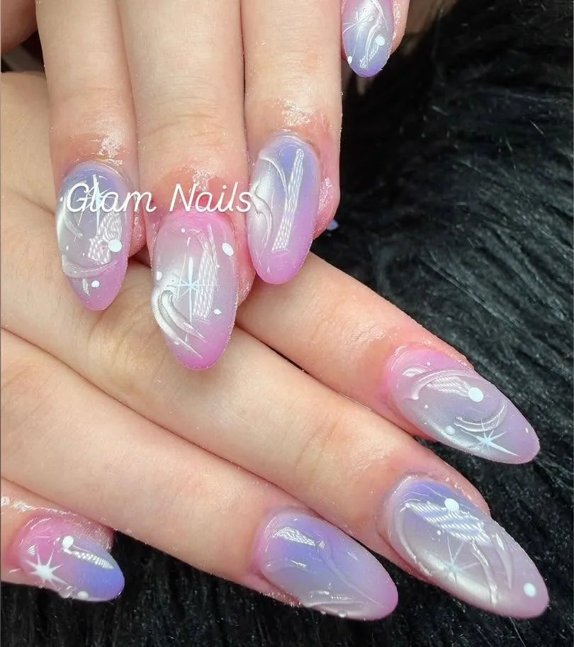 Pink and lilac aura ombré almond nails with sparkle and fine-line art