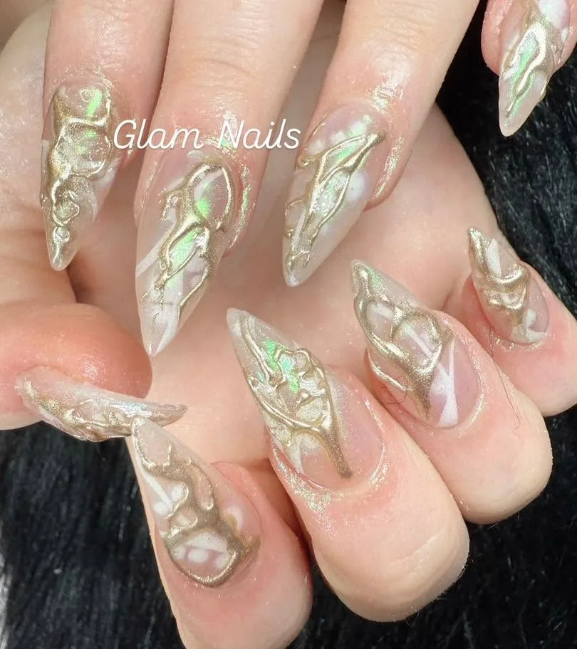 Sheer nude stiletto nails with 3D gold chrome abalone marble swirl art
