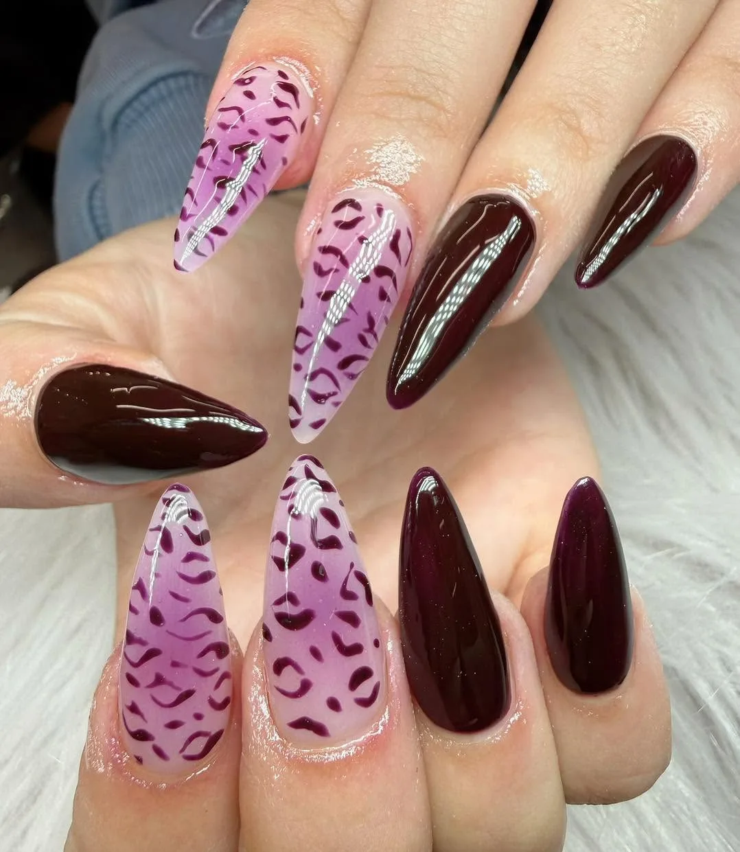 Purple leopard-print and dark plum glossy stiletto nails