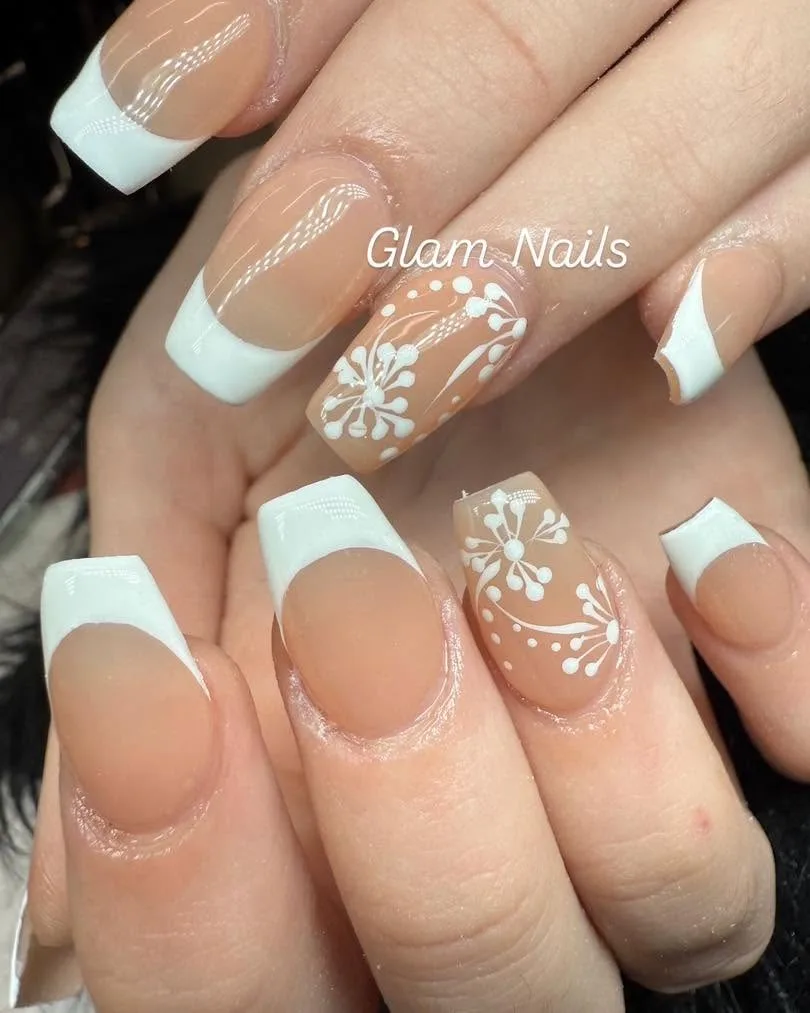 Nude long square coffin nails with white French tips and lace snowflake floral art